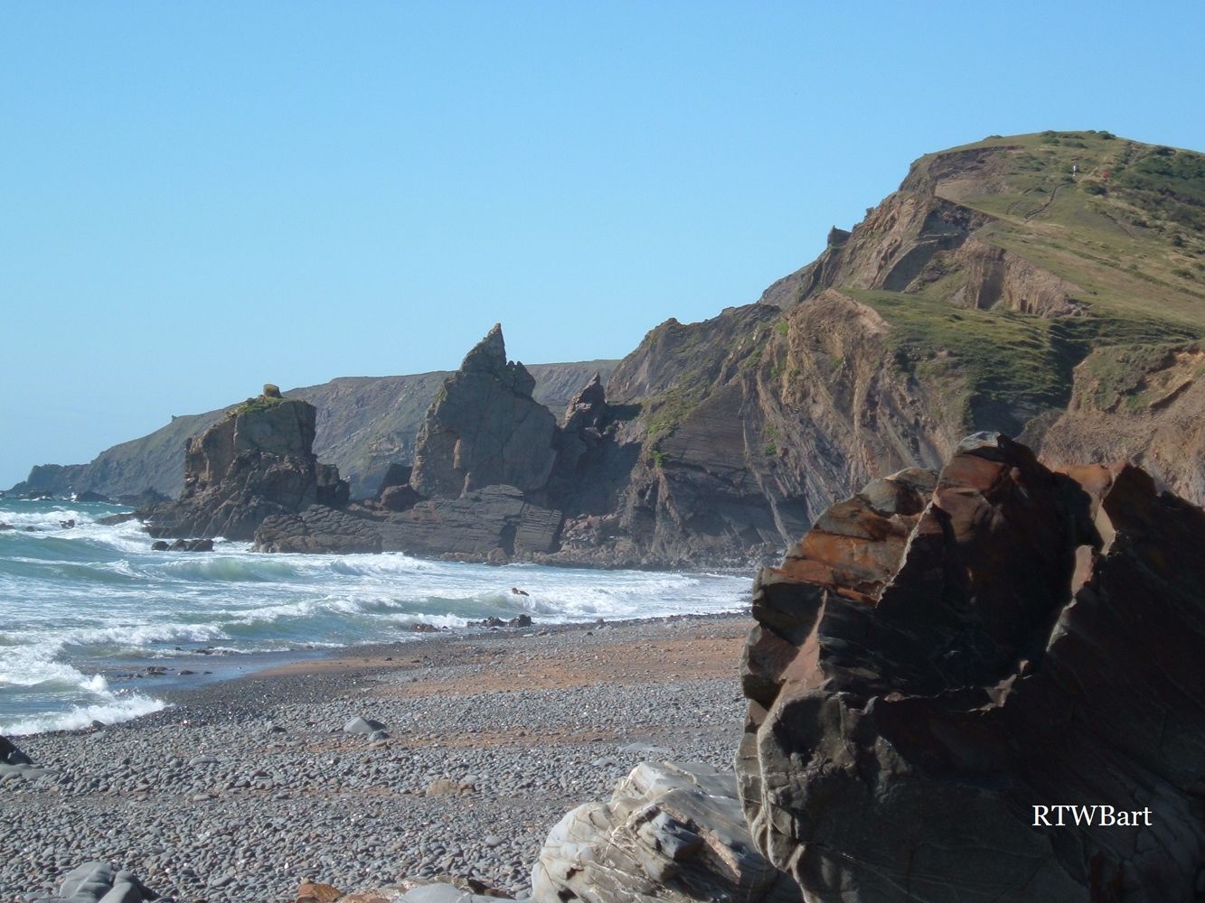 JAGGED ROCKS AT SANDYMOUTH BEACH CORNWALL