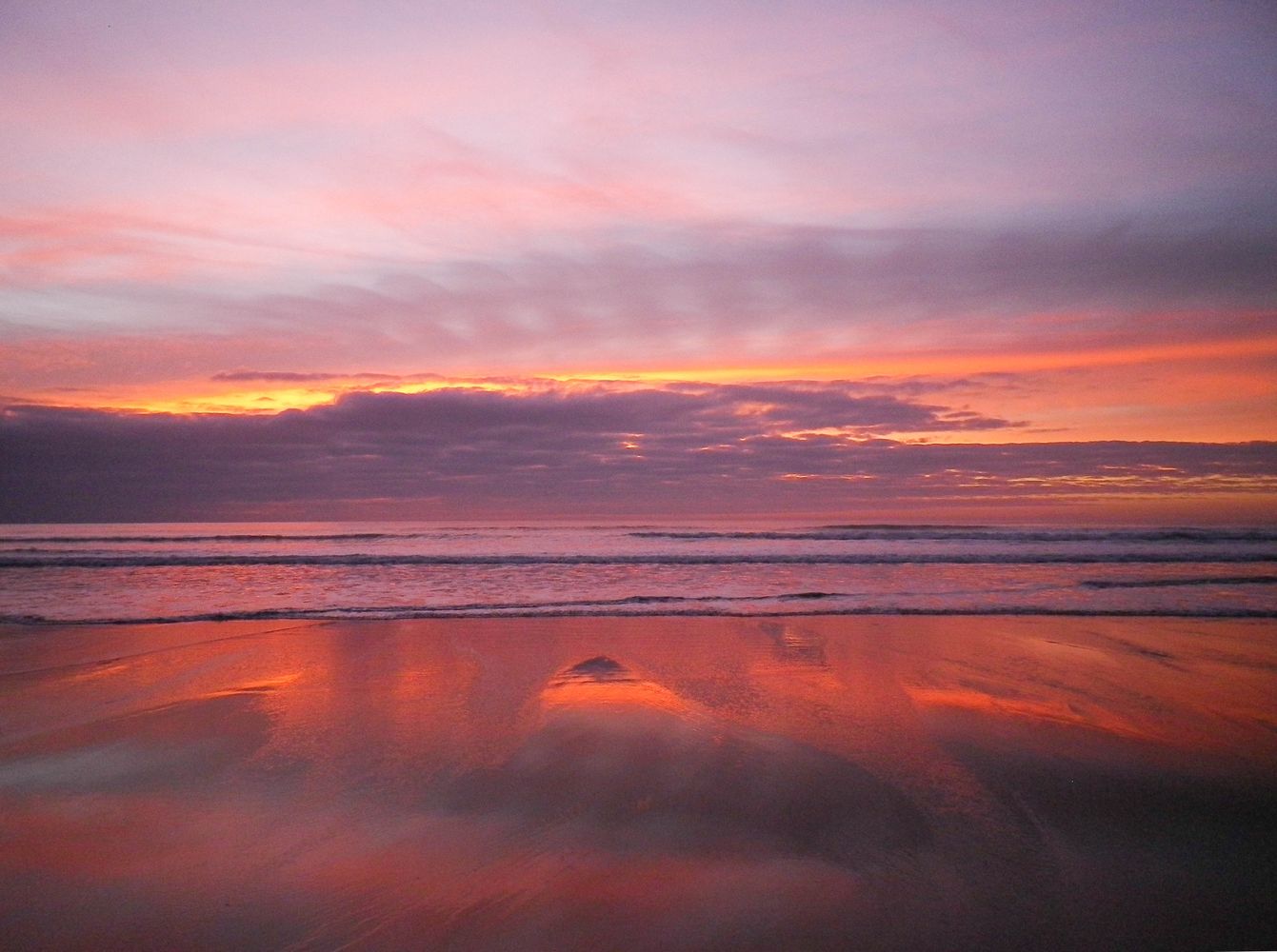 PURPLE AND ROSE GOLD SUNSET SANDYMOUTH BEACH CORNWALL