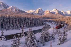 Sunrise and trains at Morants Curve in Banff National Park, Alberta, Canada	