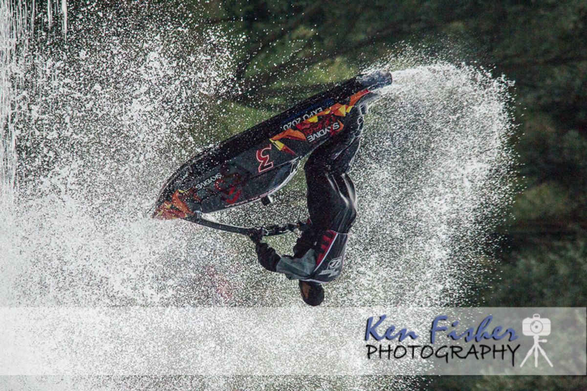 Jetski performing aerobatic tricks on a lake