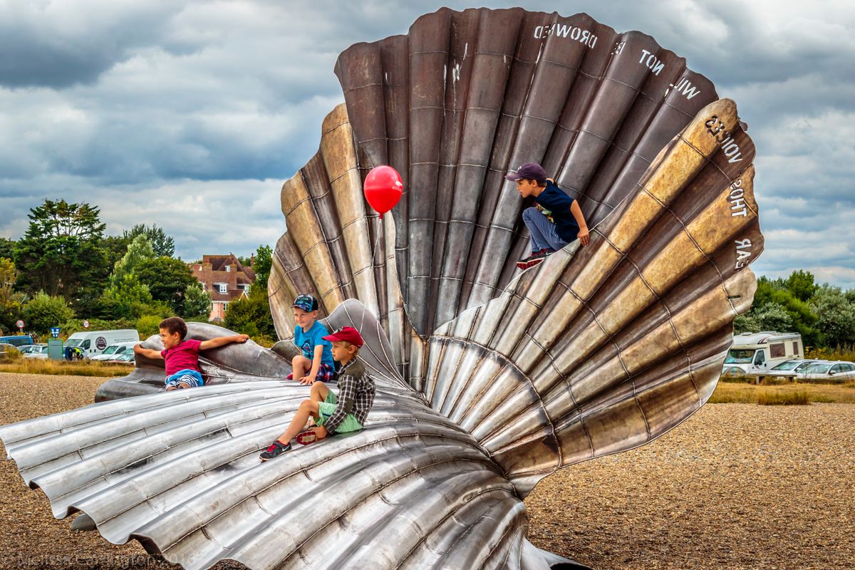 Children playing on the scallop shell 