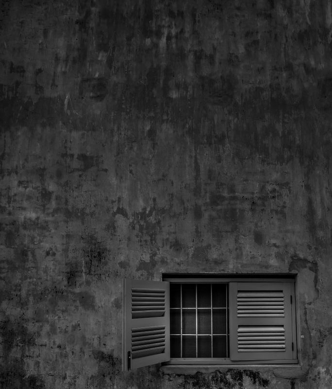 Small window on a big wall