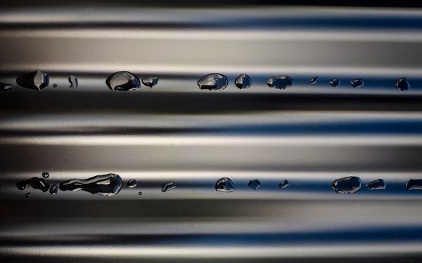 Pattern of Raindrops on Corrugated Roofing