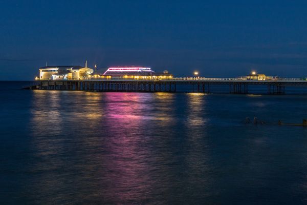 Cromer pier at night by Clive Wells