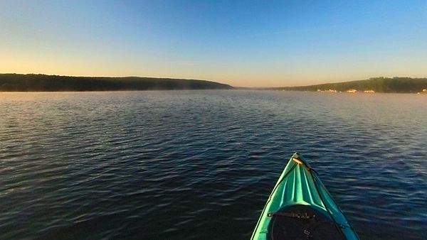Early morning kayak on Keuka Lake in the Finger Lakes of New York USA
