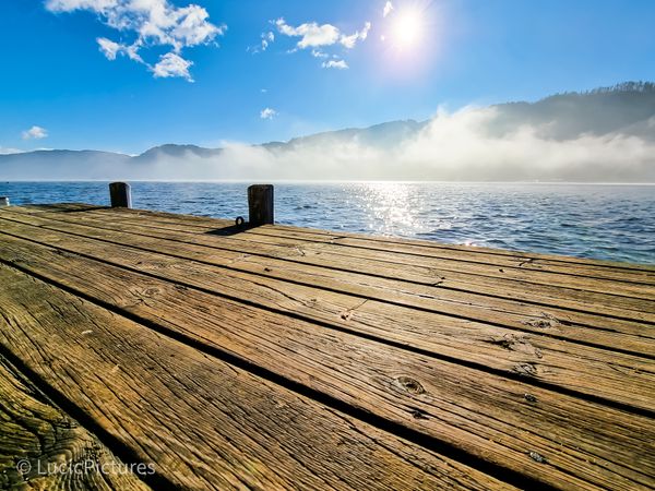 Pier and foggy lake