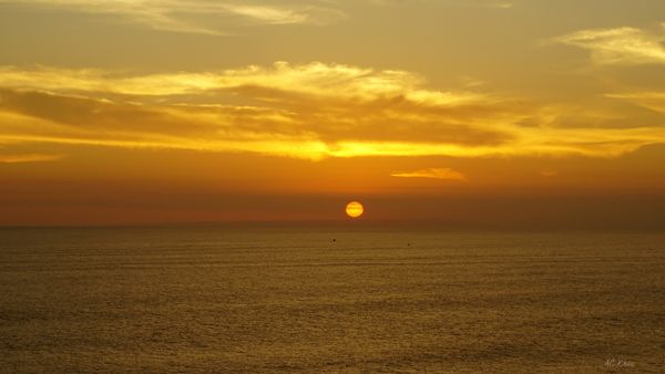 Two boats in the sunset