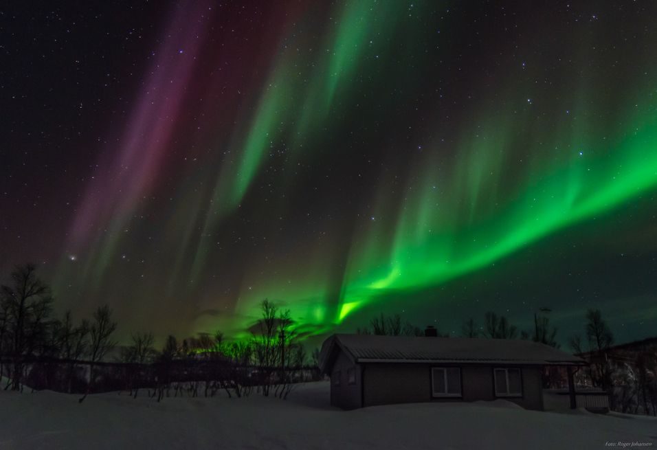 Aurora above a cabin